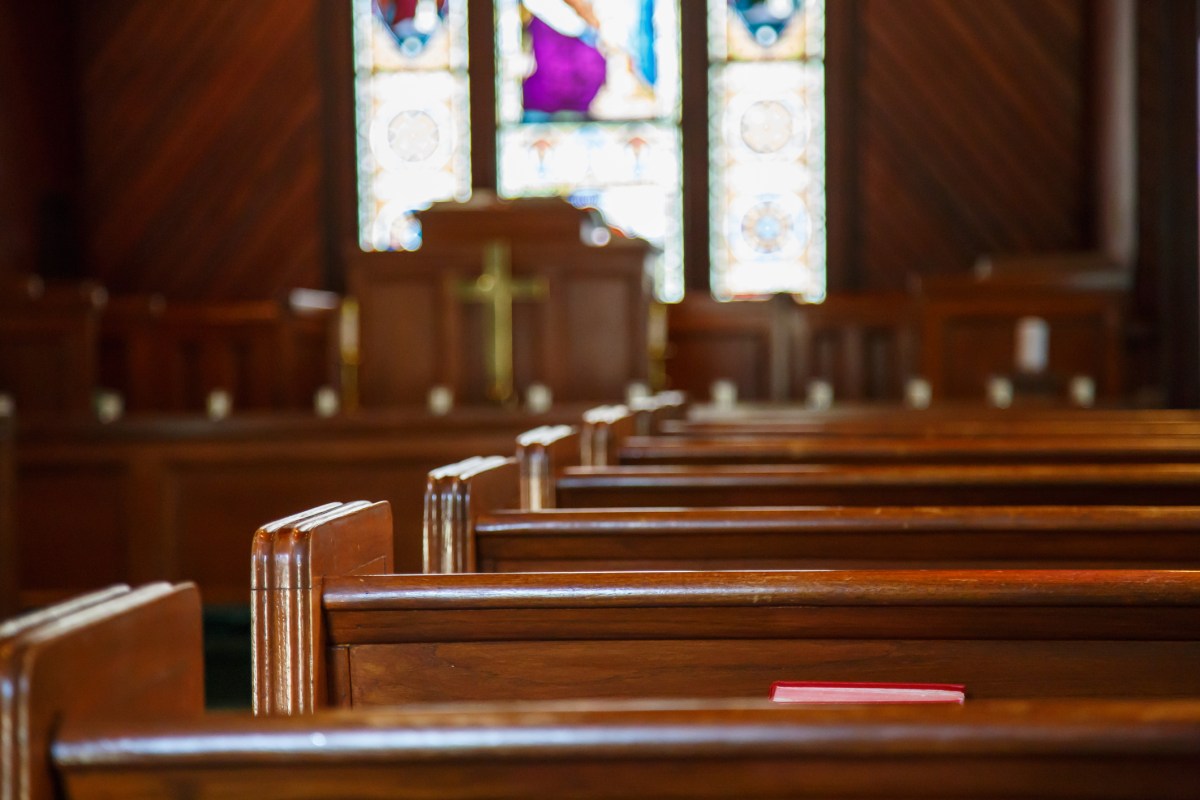 Church Pews with Stained Glass Beyond Pulpit