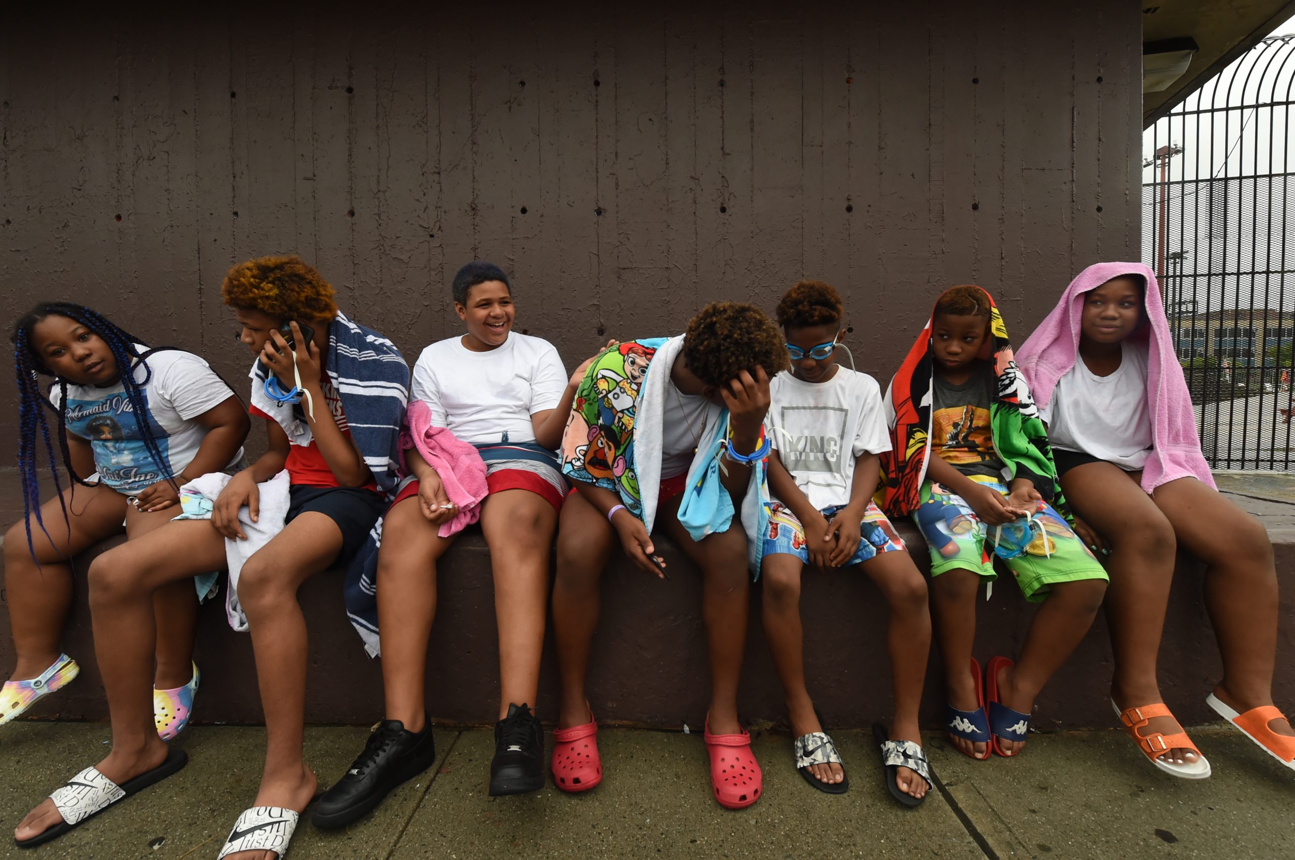 The Gordon family wait to enter the pool
