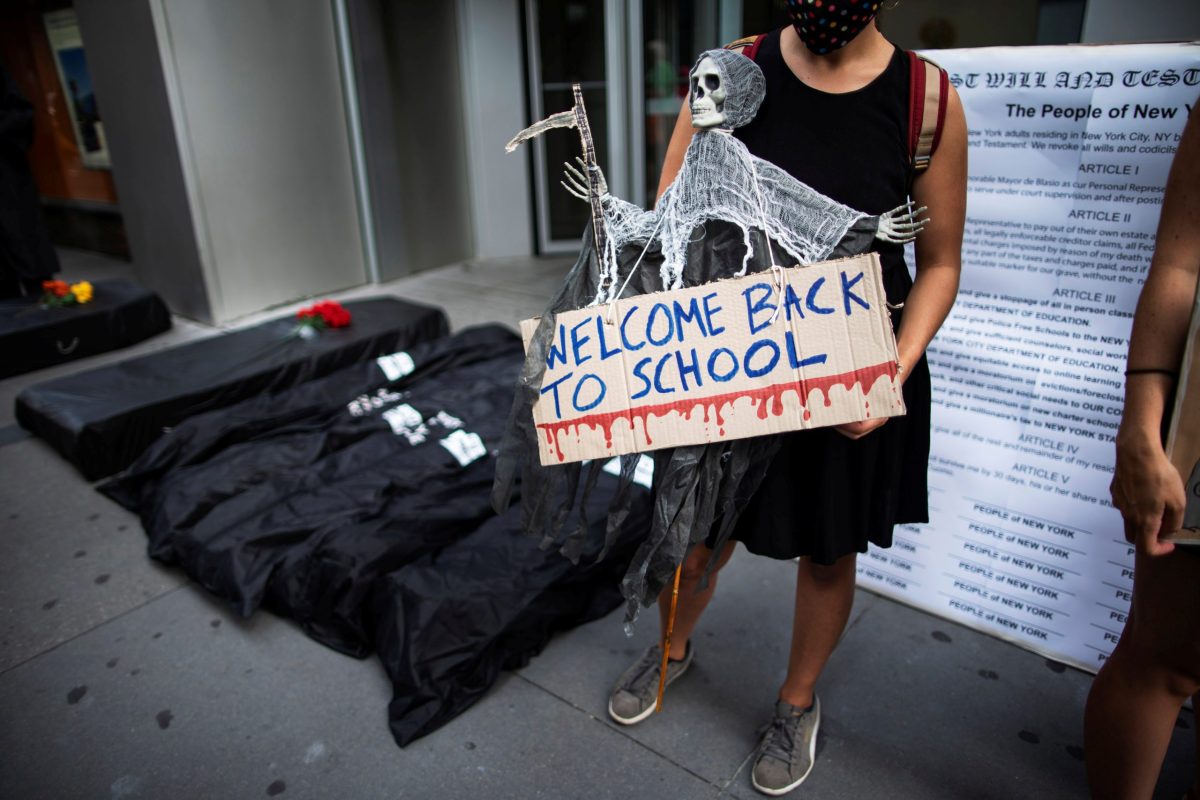 Fake morgue bags are seen near the entrance of United Federation of Teachers as symbol of students dead by the coronavirus disease (COVID-19) as people take part in a march and rally during the National Day of Resistance to schools re-opening in New York