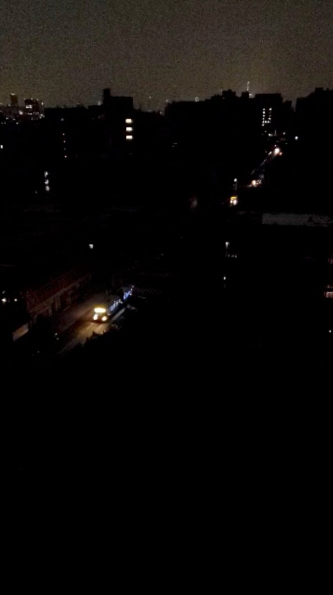 A bus goes through the street during a blackout in New York