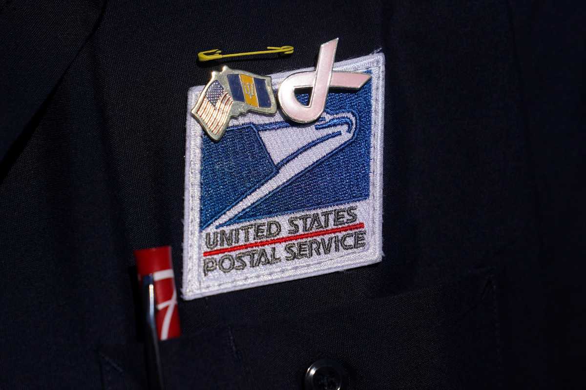 USPS badge is pictured during a news conference about the postal service in New York City