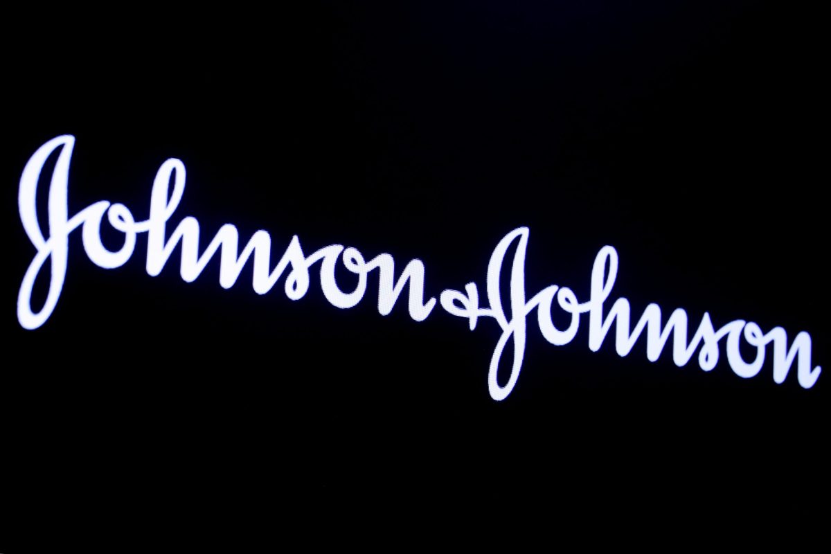 FILE PHOTO: The company logo for Johnson & Johnson is displayed on a screen to celebrate the 75th anniversary of the company’s listing at the NYSE in New York