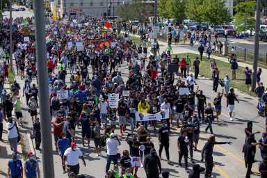 People protest after a Black man identified as Jacob Blake was shot several times by police in Kenosha