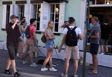 People drink outside a bar during the reopening phase following the coronavirus disease (COVID-19) outbreak in the East Village neighborhood of New York City, New York, U.S., June 13, 2020. REUTERS/Caitlin Ochs