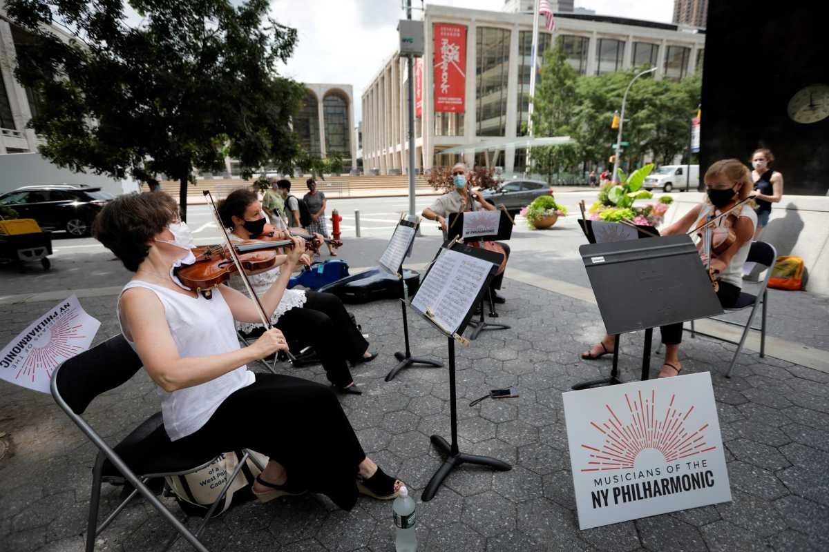 A string quartet made up of musicians from the New York Philharmonic Orchestra play first public performance since March in New York
