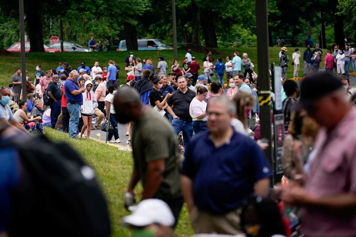 FILE PHOTO: FILE PHOTO: Hundreds of people line up outside a Kentucky Career Center hoping to find assistance with their unemployment claim in Frankfort