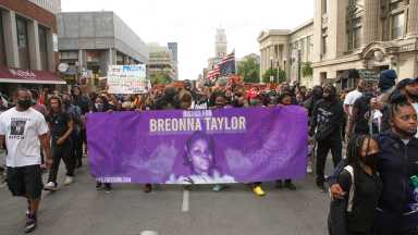 Protesters march through downtown Louisville