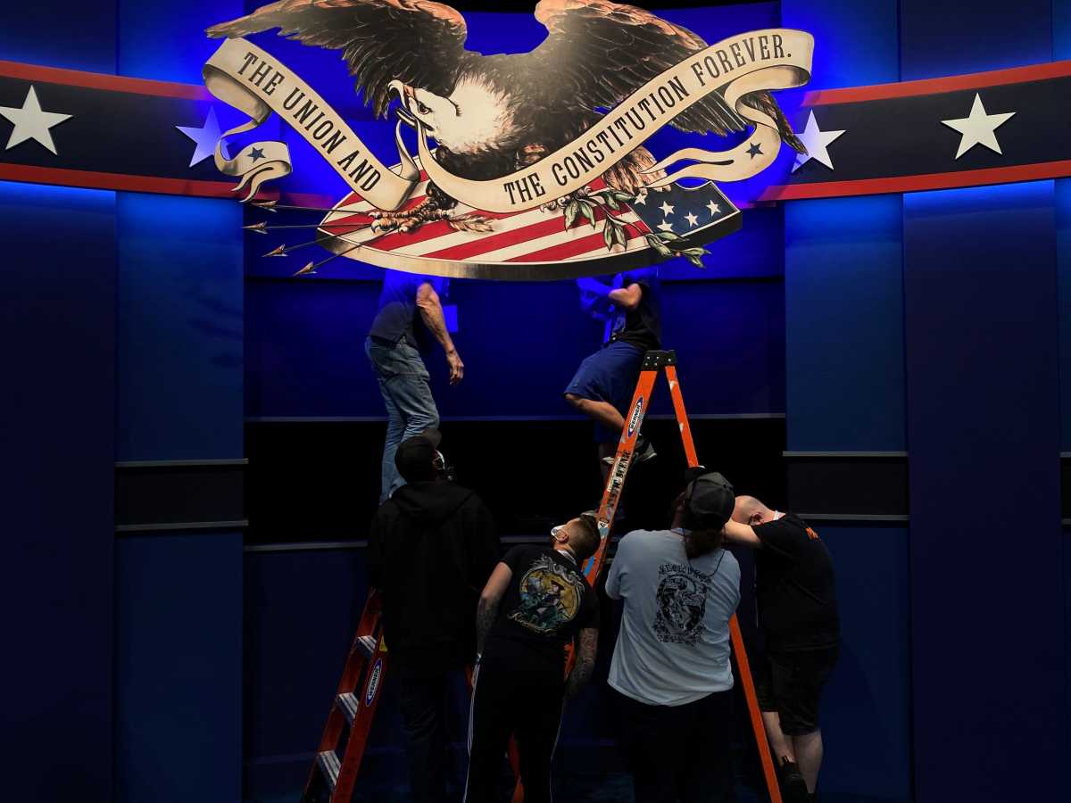 Workers prepare for the first presidential debate between U.S. President Trump and Democratic nominee Biden in Cleveland, Ohio