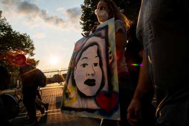 Protesters march during a peaceful protest after a grand jury decided not to bring homicide charges against police officers involved in the fatal shooting of Breonna Taylor, in Louisville