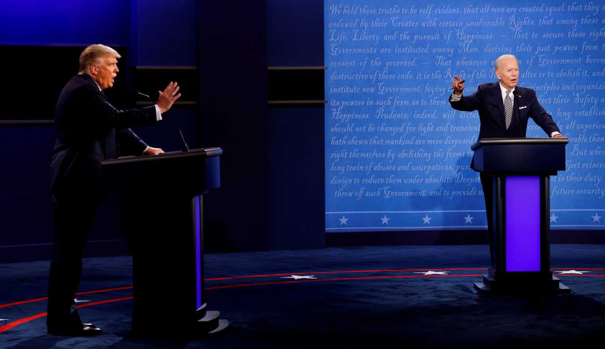 FILE PHOTO: U.S. President Donald Trump and Democratic presidential nominee Joe Biden participate in their first 2020 presidential campaign debate in Cleveland