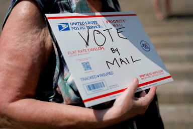 FILE PHOTO: FILE PHOTO: FILE PHOTO: U.S. Postal Service (USPS) workers rally to end mail delays and for the firing of U.S. Postmaster General Louis DeJoy in New York