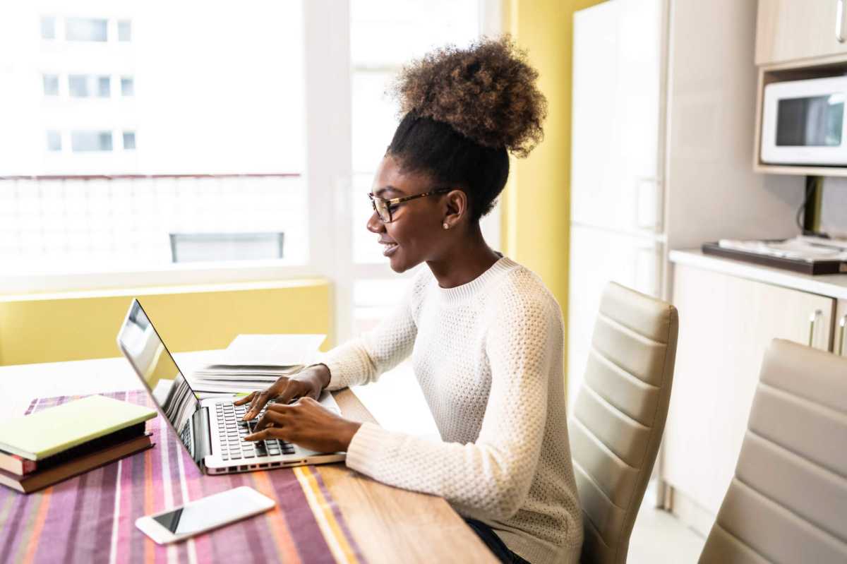Woman sitting at home and studying