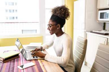 Woman sitting at home and studying