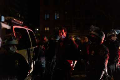 Police officers stand next to detained demonstrators near Washington Square park the day after Election Day in Manhattan, New York City