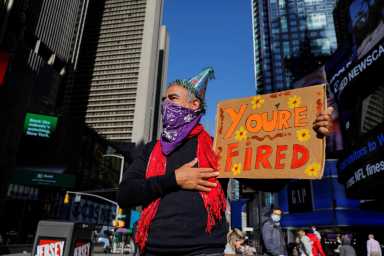 Joe Biden supporter Rene Calvo of New York City stands in Times Square awaiting election results, in Manhattan, New York City