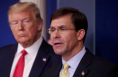 FILE PHOTO: U.S. President Trump listens to Secretary of Defense Mark Esper speak about coronavirus response at the White House in Washington