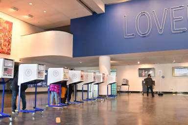 People cast their vote inside the Brooklyn Museum during the 2020 election.