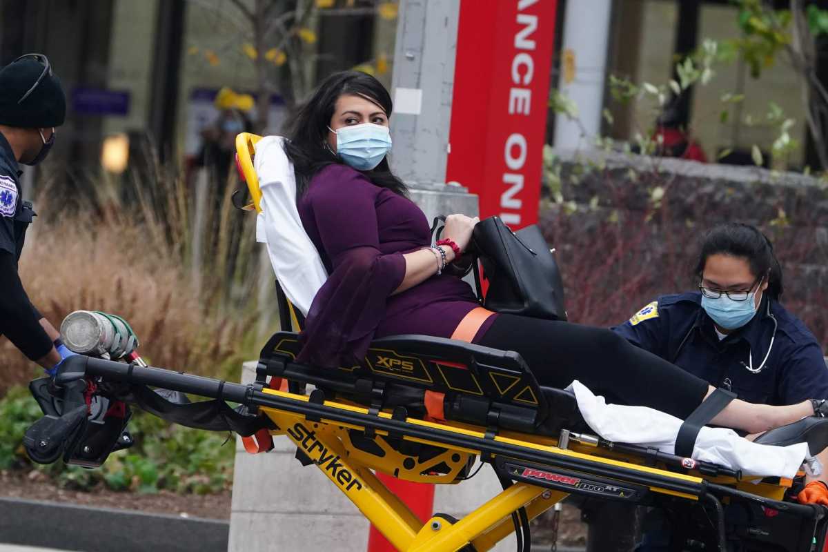 A patient is wheeled into a hospital during the coronavirus (COVID-19) pandemic