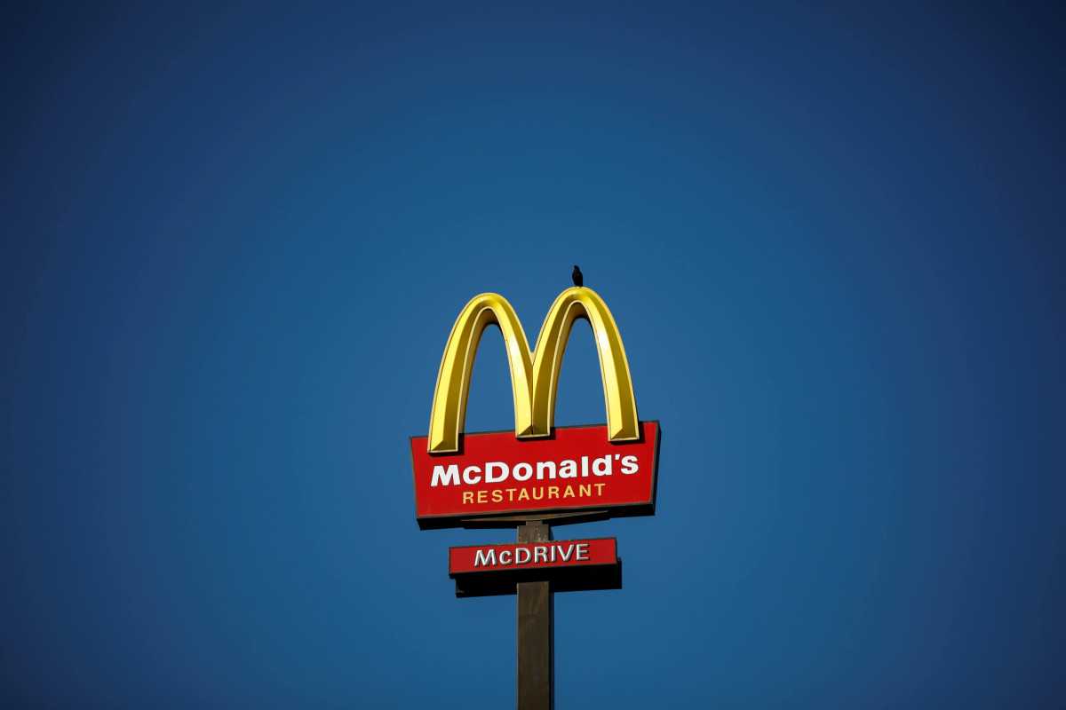 FILE PHOTO: The McDonald’s company logo stands on a sign outside a restaurant in Bretigny-sur-Orge, near Paris