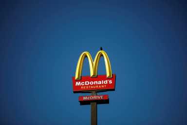 FILE PHOTO: The McDonald’s company logo stands on a sign outside a restaurant in Bretigny-sur-Orge, near Paris