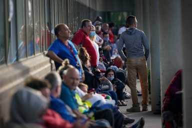 People wait outside Kentucky Career Center in Frankfort