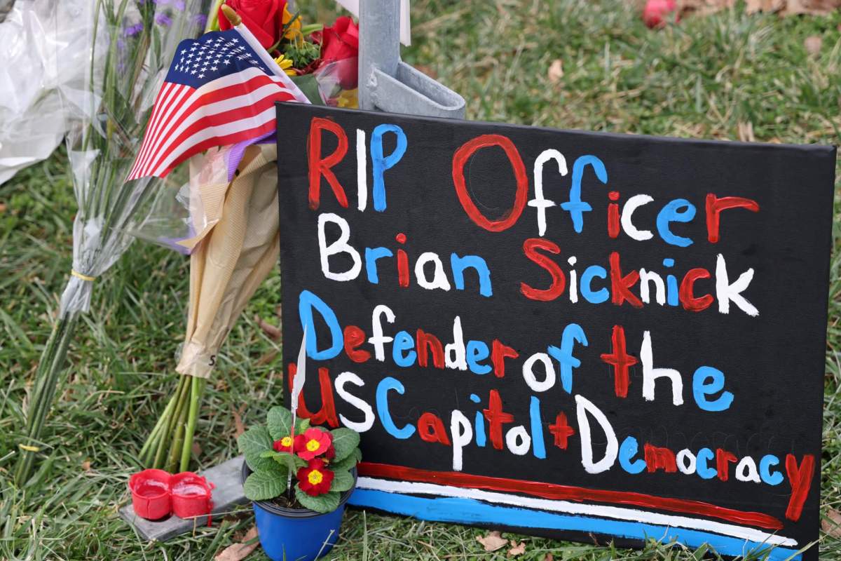 Items are left to memorialize slain U.S. Capitol Police officer Sicknick at the U.S. Capitol in Washington