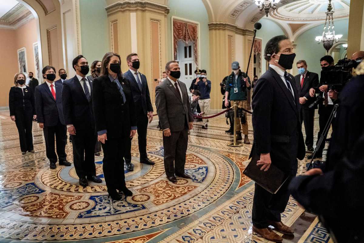FILE PHOTO: Article of impeachment against former president Trump delivered to Senate