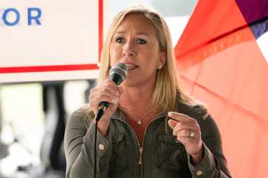FILE PHOTO: Marjorie Taylor Greene speaks a news conference in Dallas