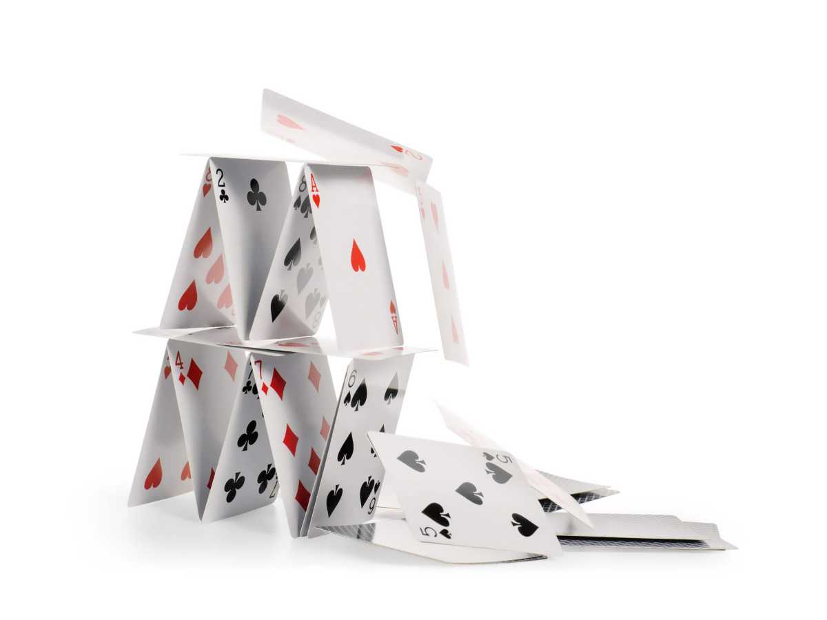 Editorial | Following the facts 1 Falling house of cards isolated with clipping path