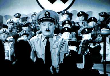 Visitors look at an extract of “The Great Dictator” during a media tour of ‘Chaplin’s World’ in Corsier