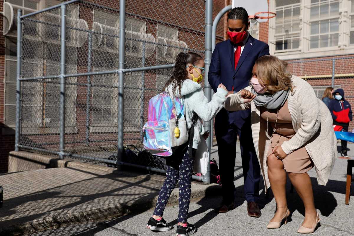 Meisha Porter, Chancellor of the New York City Department of Education, greets students as they return to school in Manhattan, New York