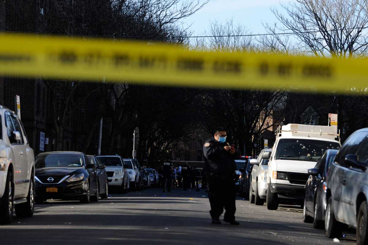 Police from the 70 Precinct probe a double shooting at 50 East 18 Street.