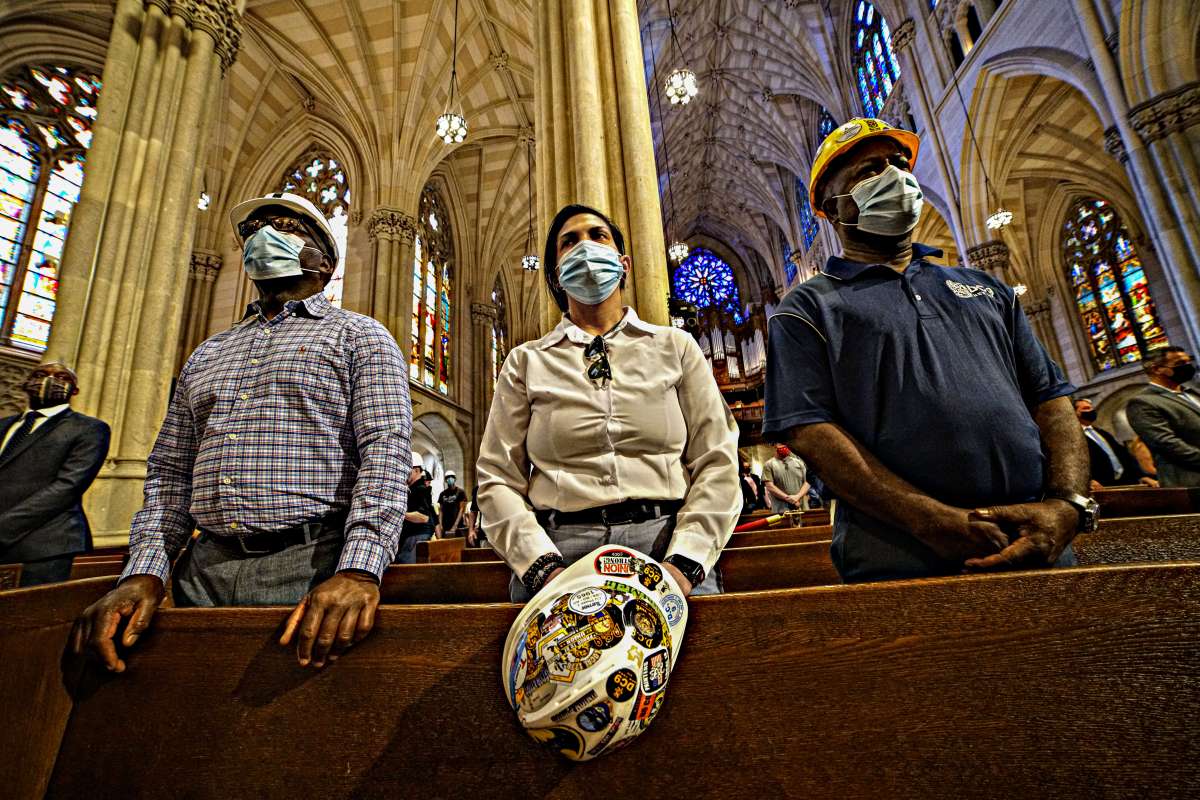 Hard hat memorial: Construction workers remembered during annual mass at St. Patrick's Cathedral 2 Lowering their hats, workers paid their final respects