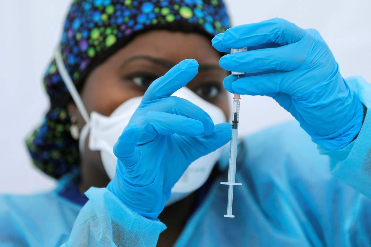 Coronavirus disease (COVID-19) vaccination event outside the Bronx Writing Academy school in New York City