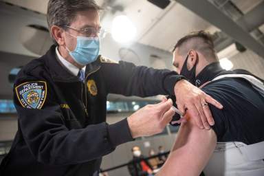 Members Of New York Police Department Receive Covid-19 Vaccine