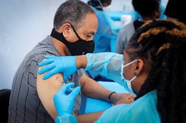 Coronavirus disease (COVID-19) vaccination event outside the Bronx Writing Academy school in New York City