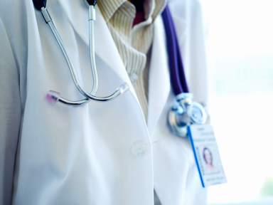 Detail of a doctor’s stethascope and name badge