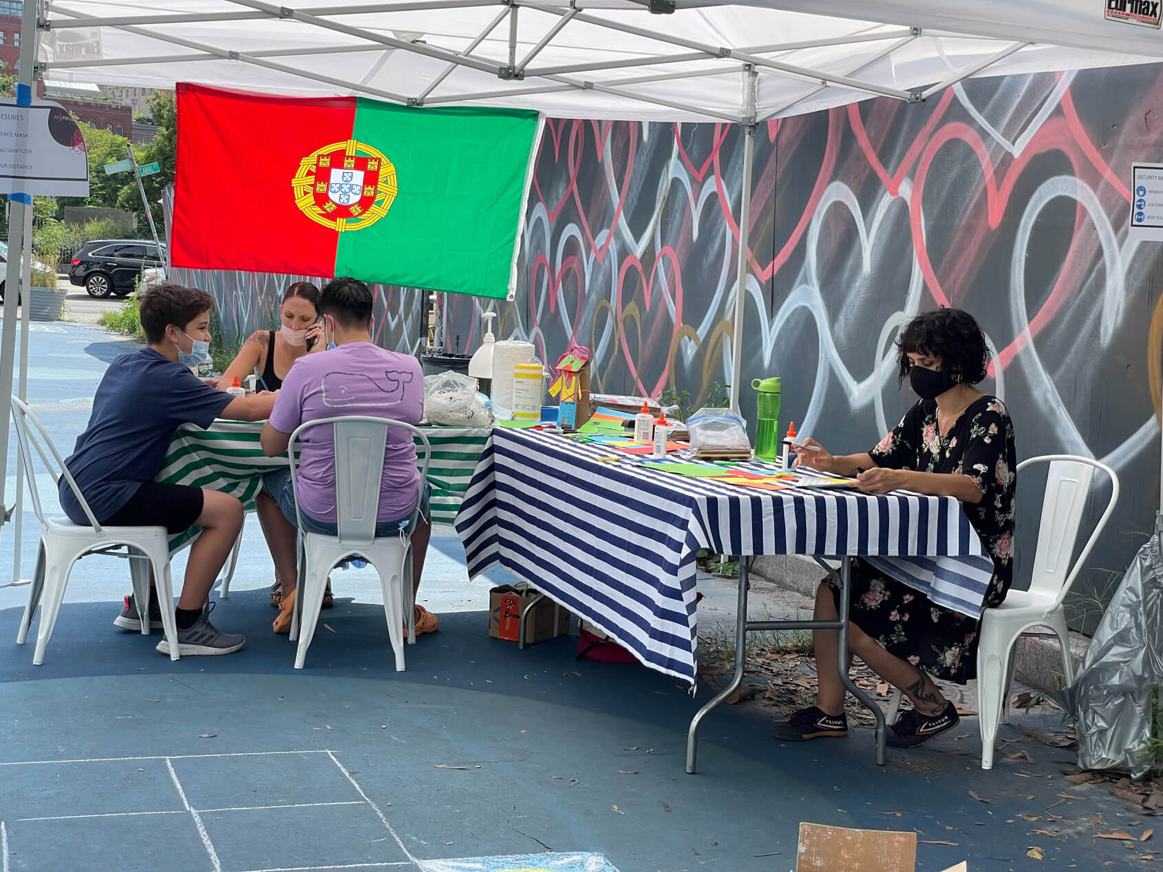 Under the flag of Portugal (seen here from the reverse side) young people are encourage to express themselves through art.