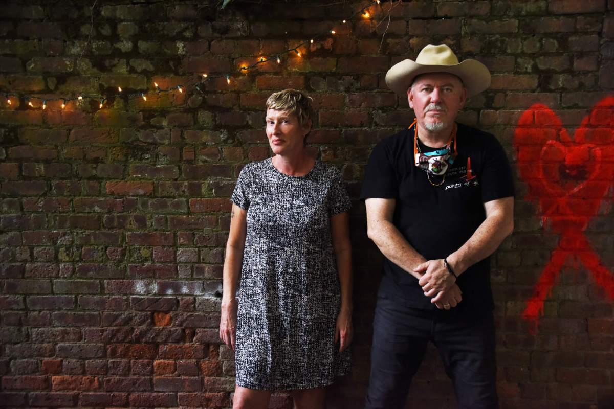 Sally Timms and Jon Langford in the backyard of the Village Works bookstore.