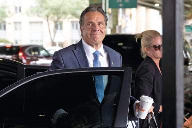 New York Governor Andrew Cuomo arrives to depart in his helicopter after announcing his resignation in Manhattan, New York City