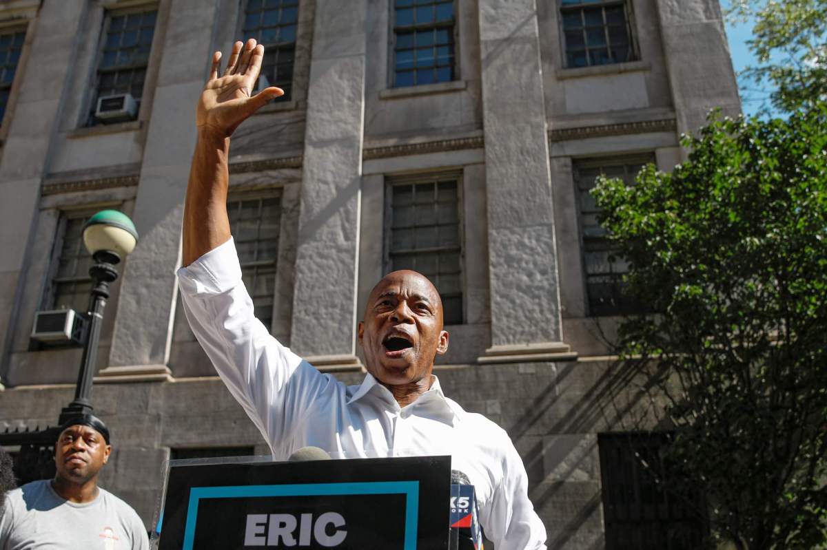 Eric Adams speaks during a news conference outside Brooklyn borough hall in Brooklyn, New York