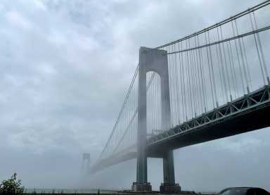 The Verrazzano-Narrows bridge is seen in morning fog, in New York City