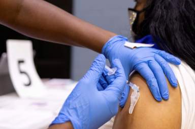 FILE PHOTO: Adolescents receive COVID-19 vaccine