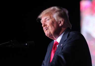 FILE PHOTO: Former U.S. President Donald Trump attends a rally in Perry