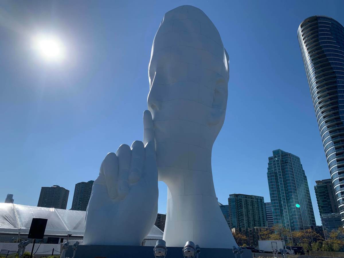 "Water Soul" sculpture by artist Jaume Plensa on Newport Pier.