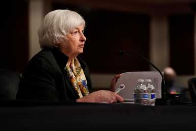 FILE PHOTO: Treasury Secretary Janet Yellen and Federal Reserve Chair Jerome Powell testify before a Senate Banking Committee hybrid hearing on oversight of the Treasury Department and the Federal Reserve on Capitol Hill in Washington