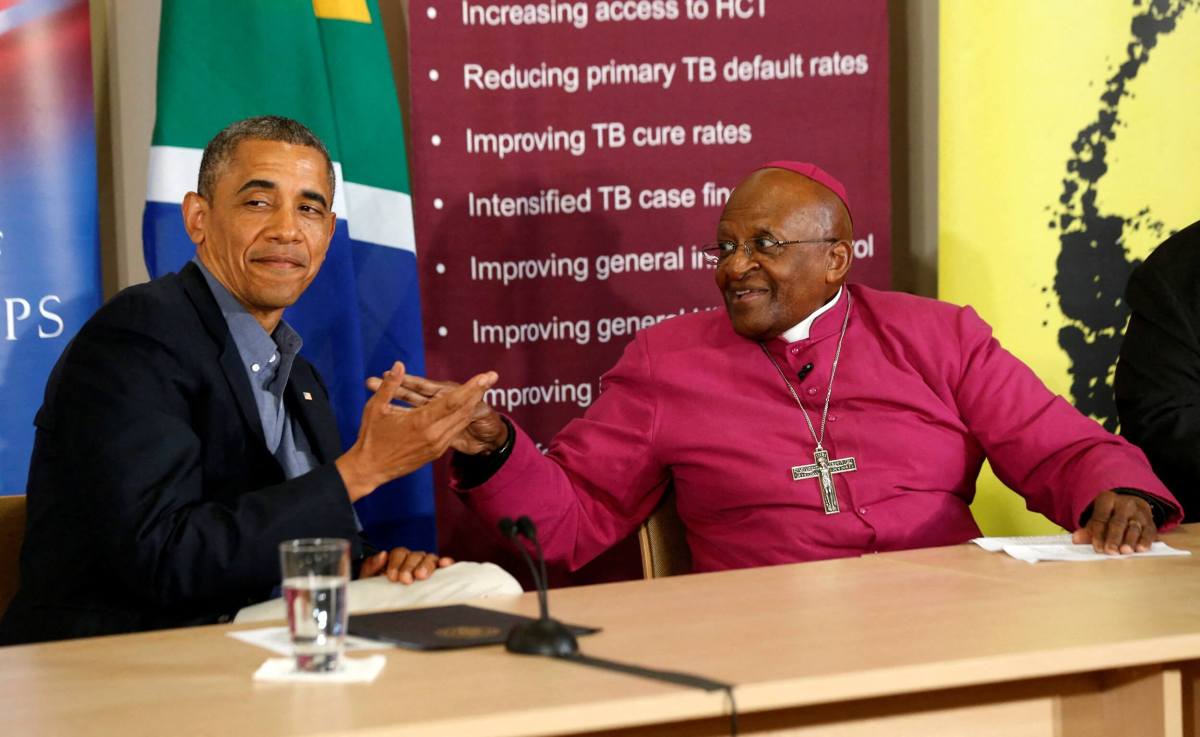 FILE PHOTO: U.S. President Barack Obama is pictured alongside Desmond Tutu as he visits his HIV Foundation Youth Centre and takes part in a health event with youth in Cape Town