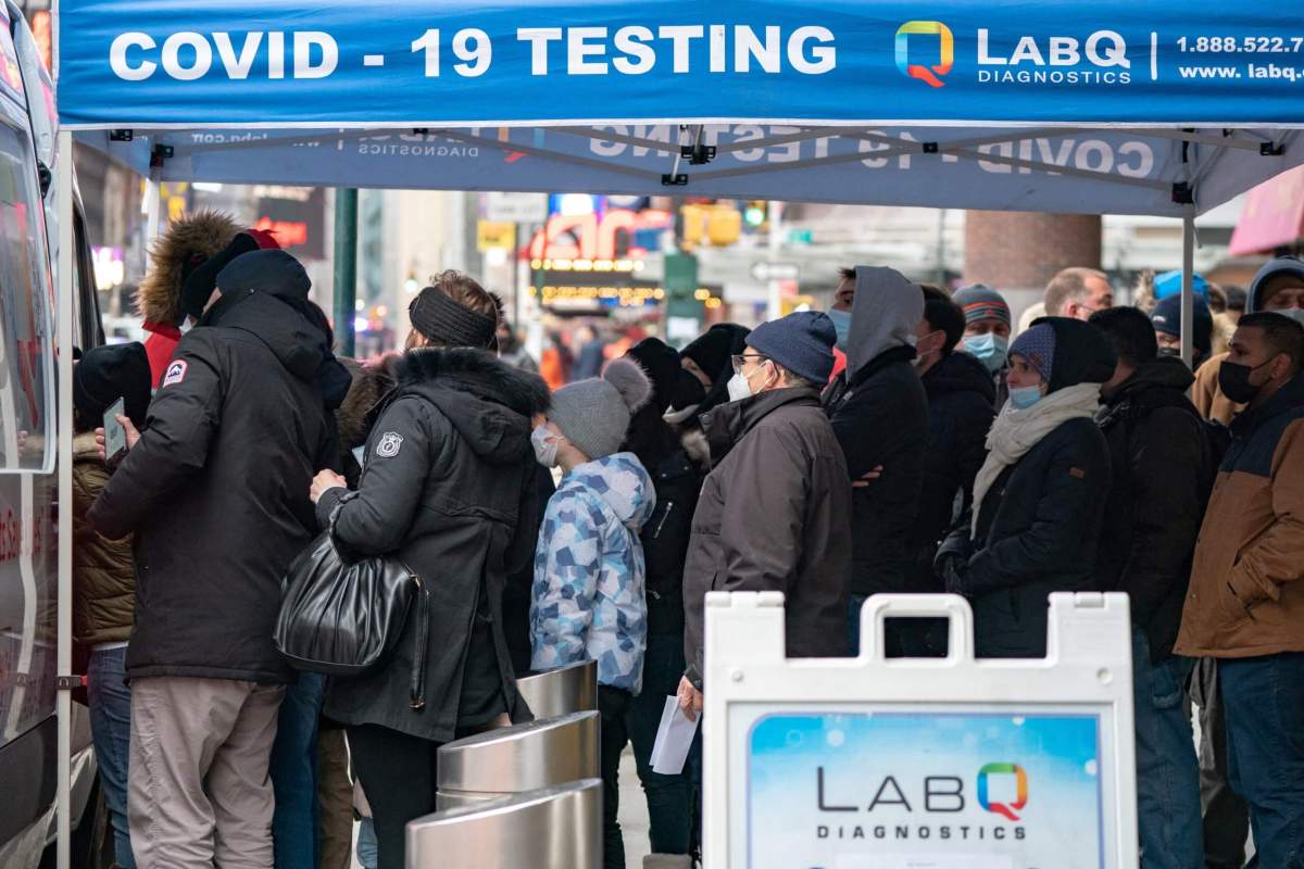 People queue at a popup COVID-19 testing site in New York