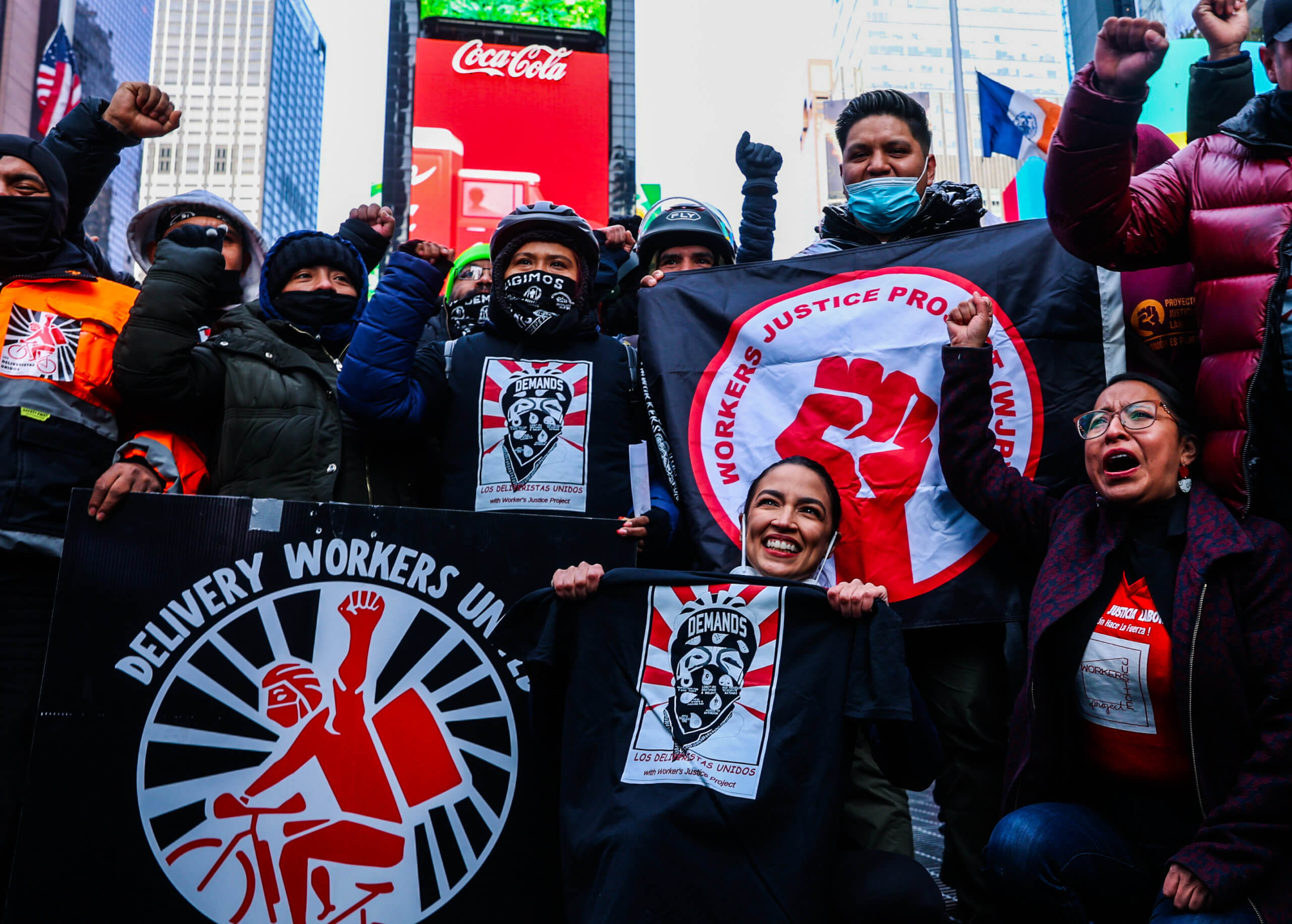 Delivery workers, advocates celebrate in Times Square new labor rights taking effect Monday 7