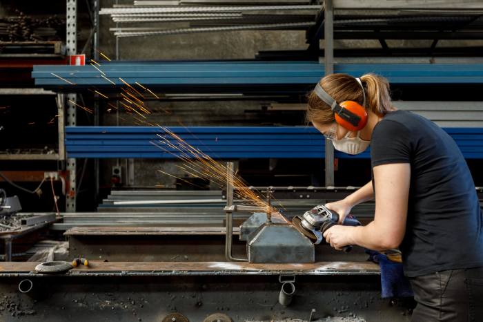 Female Tradesperson In Workshop